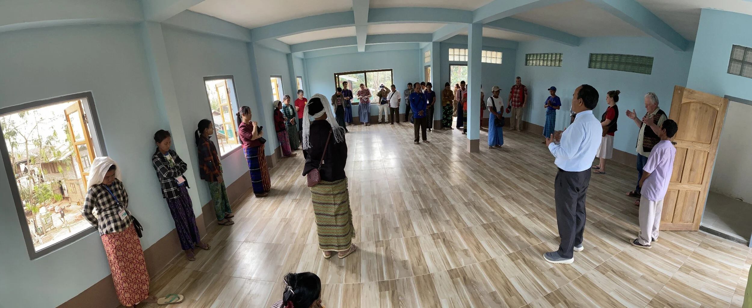 Praying for and dedicating the newly constructed second floor at the New Pathway Home for Widows