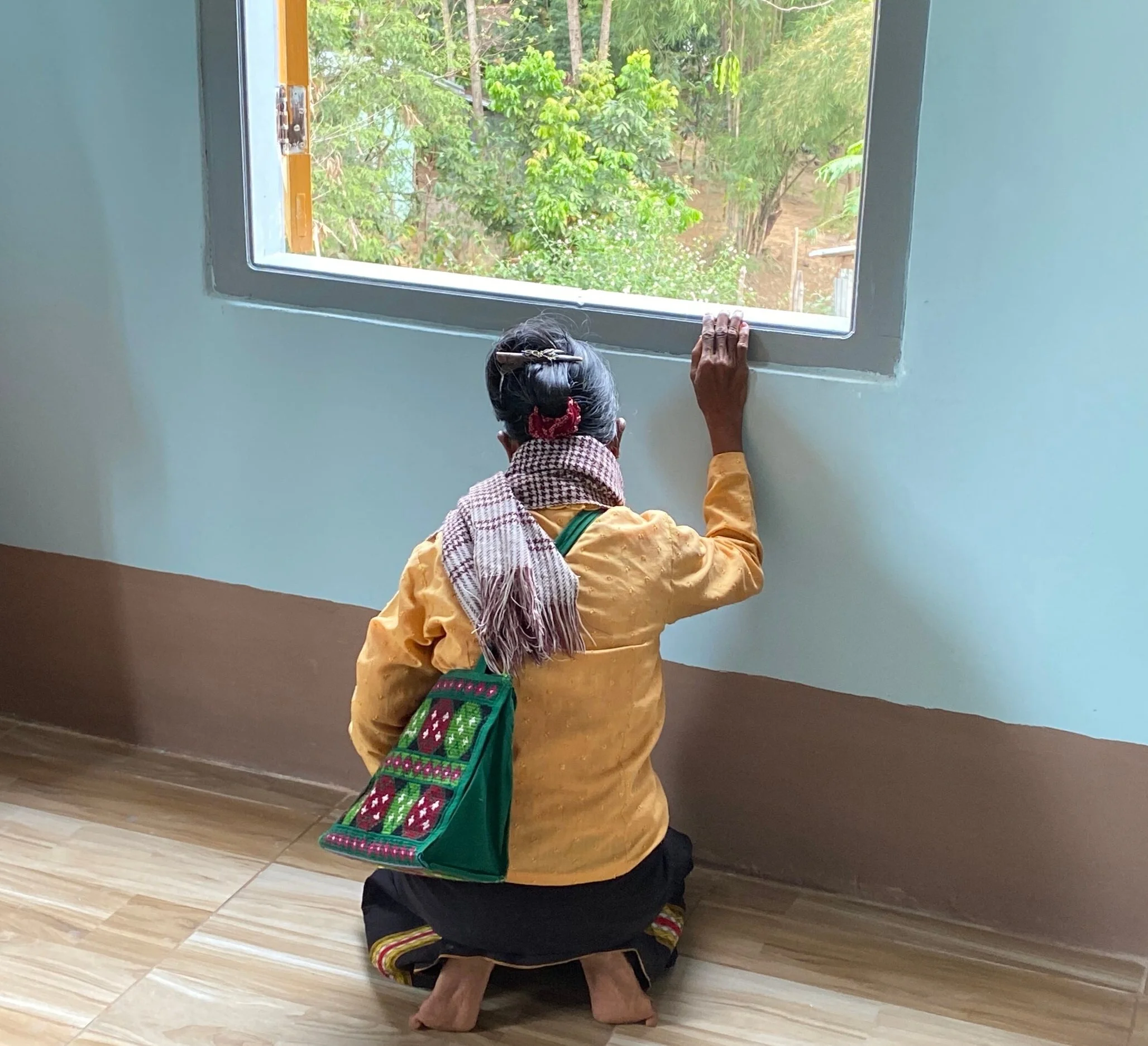 Praying for the new second floor at the New Pathway Home for Widows