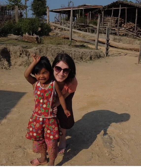 Annie Hamerlinck with a child from a remote village